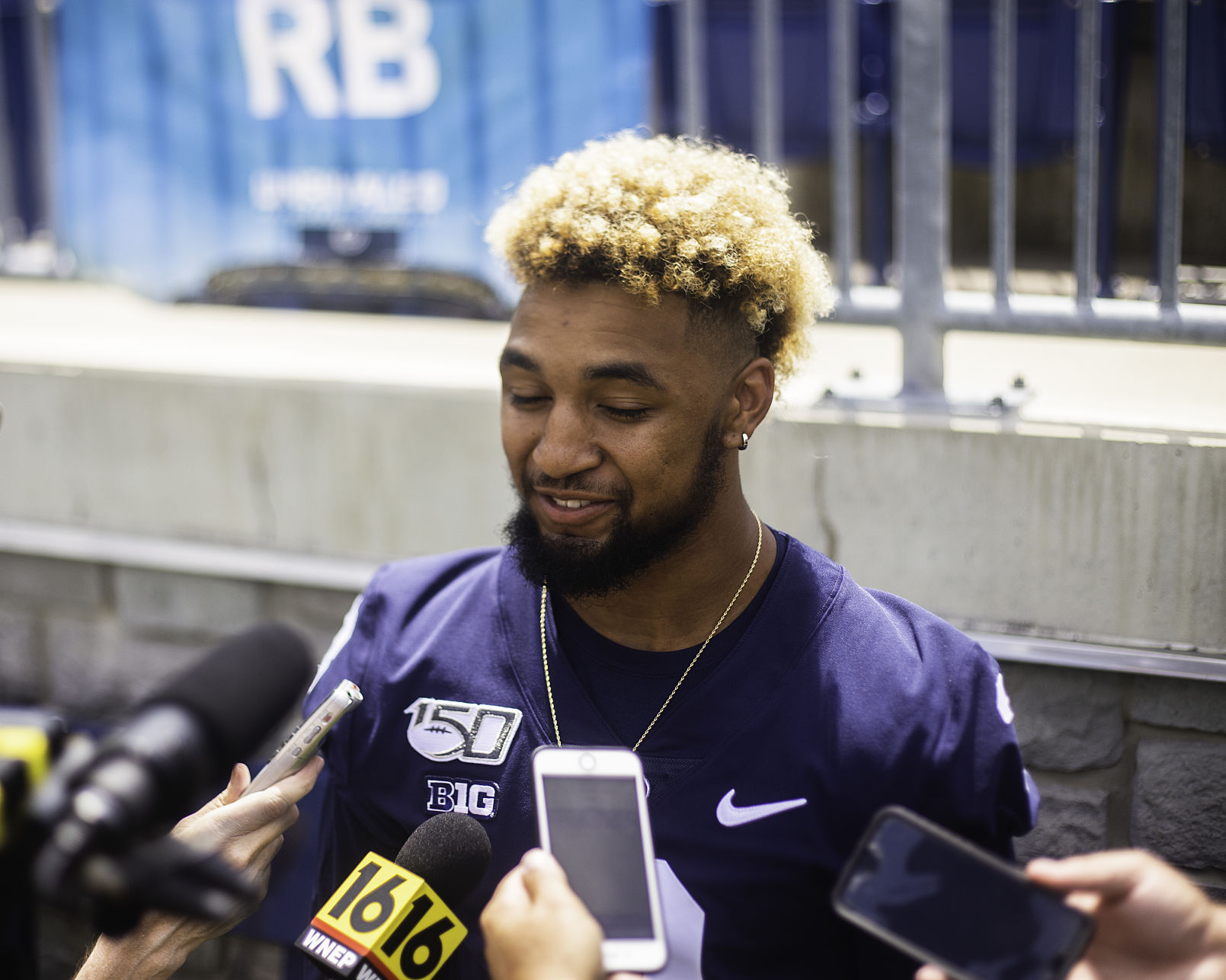Football Media Day, Ricky Slade (3), answers questions